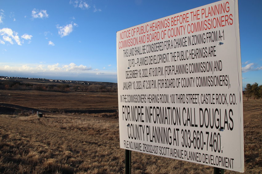 A sign stands to give notice of the public hearings that the county Planning Commission and county commissioners held regarding plans for a proposed apartment complex in the area, near the Town of Parker.